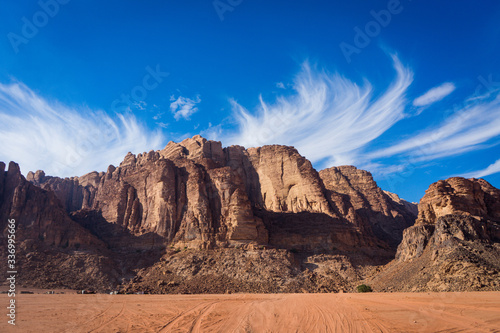 Jebel Rum rock in wadi rum desert, sunny day between wadi rum stones and mountains