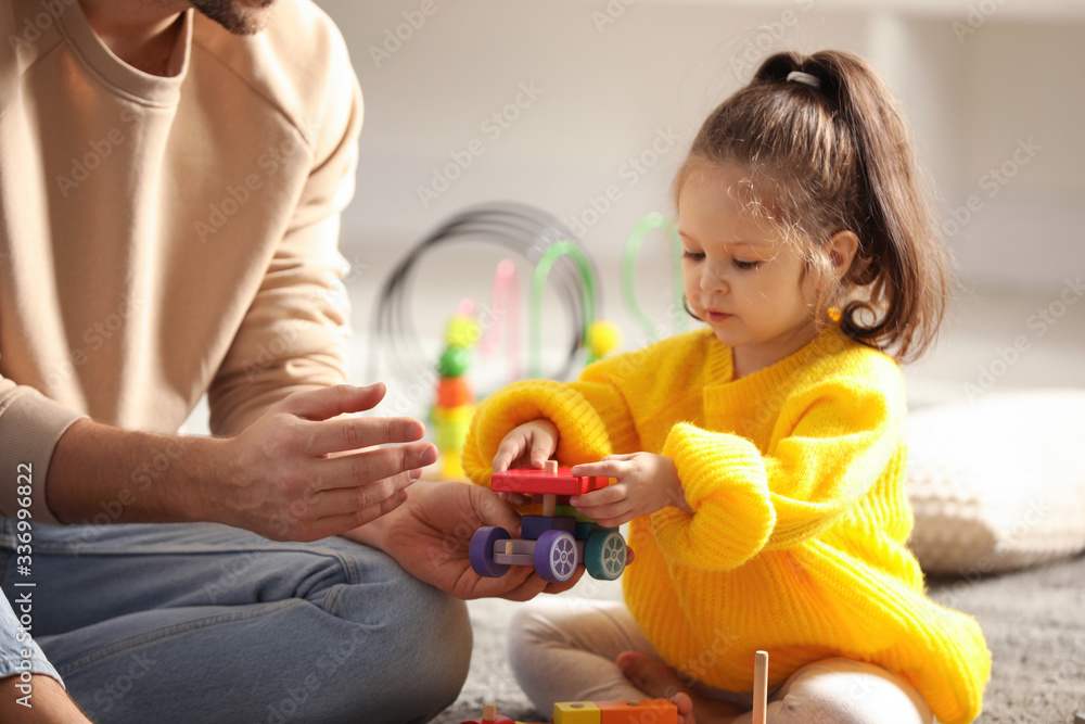 Father playing with his child at home Father playing with his child at home