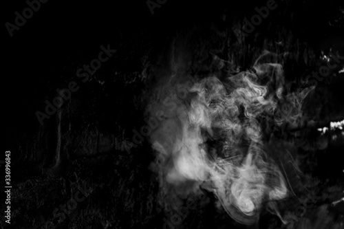 White smoke isolated on a black background. smoke image is like a ghost