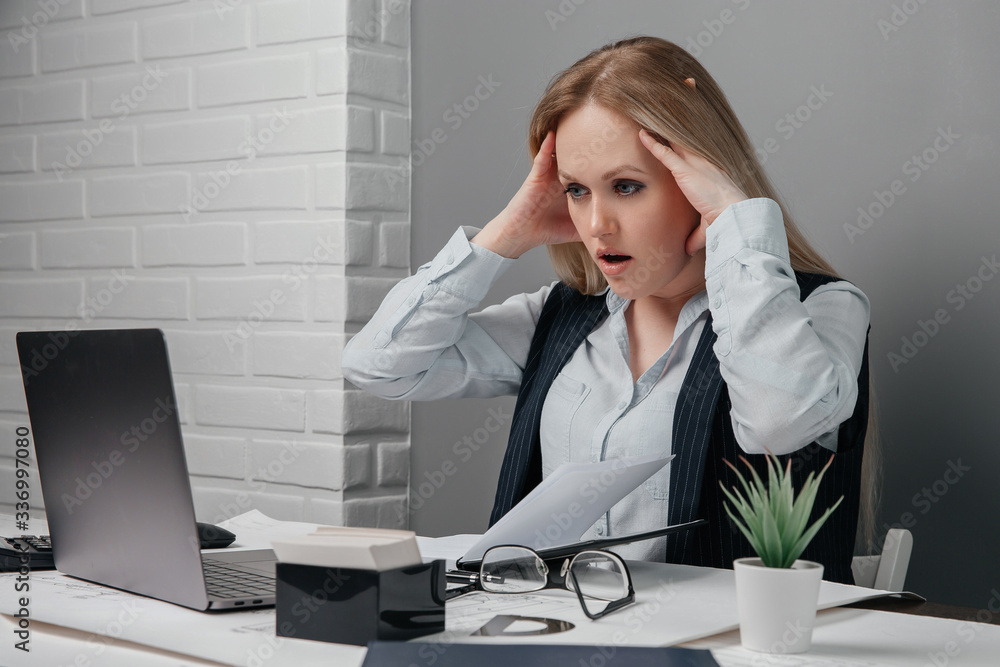 Tired businesswoman working on her computer in the office. End of the working day. Business concept Tired businesswoman working on her computer in the office. End of the working day. Business concept