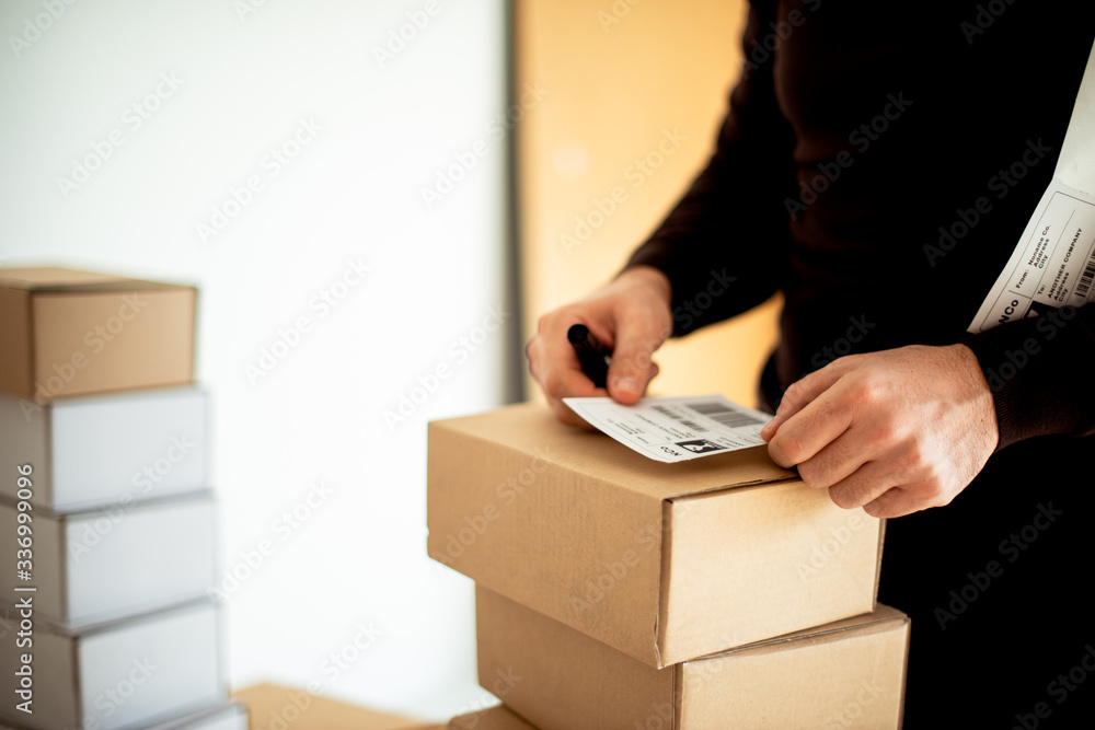 Delivery service, applying a shipping label
Delivery service, applying a shipping label