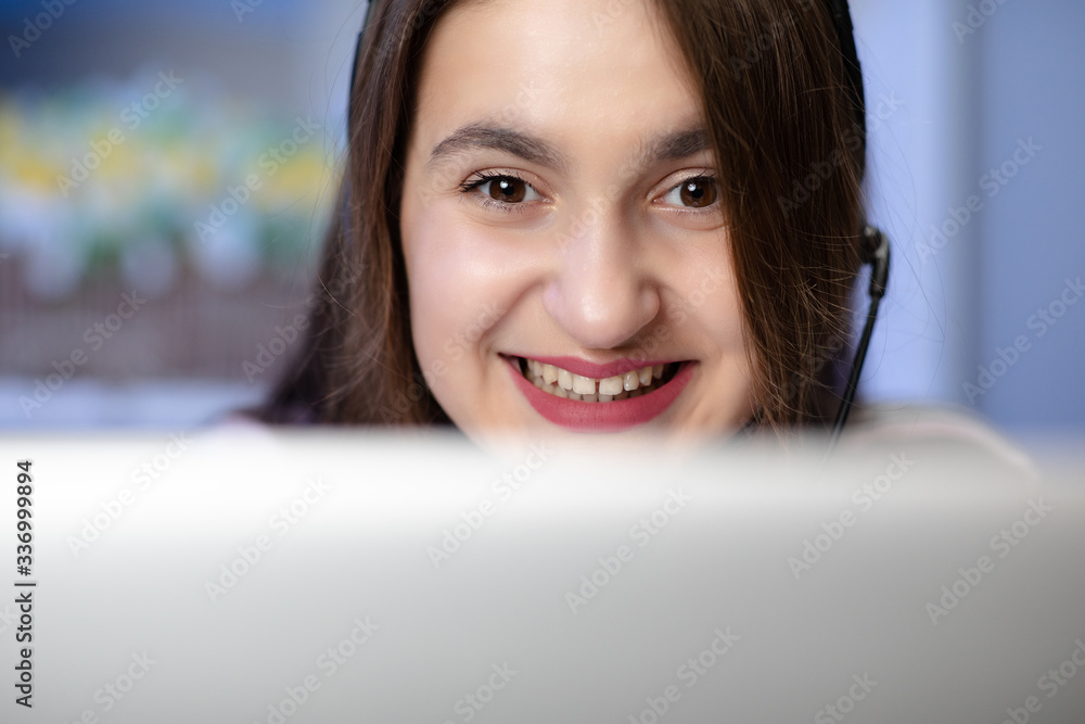 Young female helpline operator secretary make conference video call. Woman receptionist wear headset consulting customer looking at computer talking with client in online computer chat Young female helpline operator secretary make conference video call. Woman receptionist wear headset consulting customer looking at computer talking with client in online computer chat