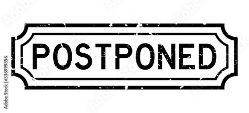 Grunge black postponed word rubber seal stamp on white background