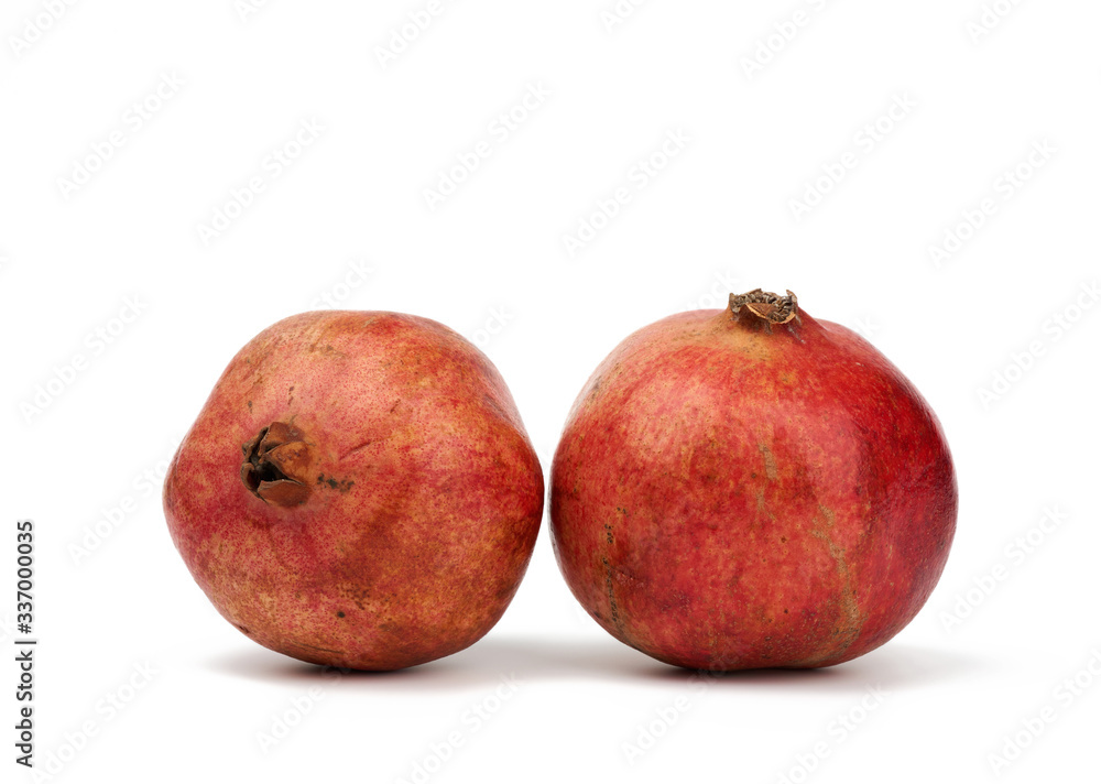 round red ripe pomegranate fruit in peel isolated on a white background, close up round red ripe pomegranate fruit in peel isolated on a white background, close up