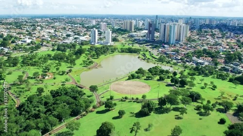 Speedy zoom video of the city of Campo Grande MS, Brazil and the park of the indigenous nations. Big wooded city with a park, lake, green areas and low density buildings. Aerial view.