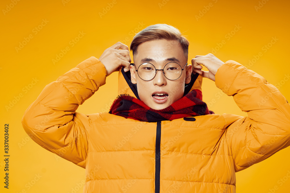 young man in a suit with hands on his face young man in a suit with hands on his face