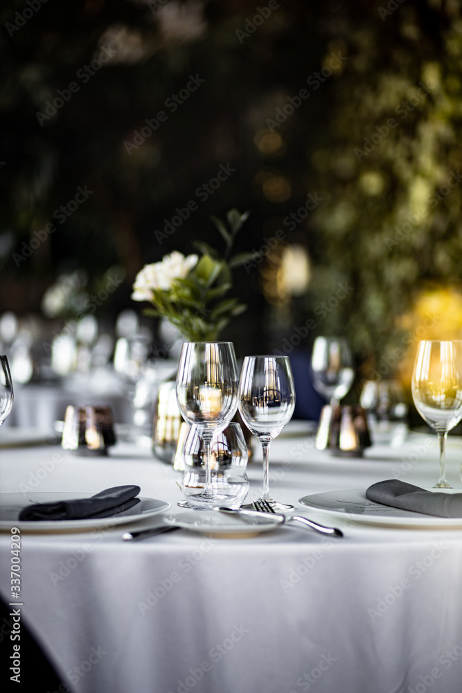 Beautiful table set for an event party or wedding reception . restaurant interior	