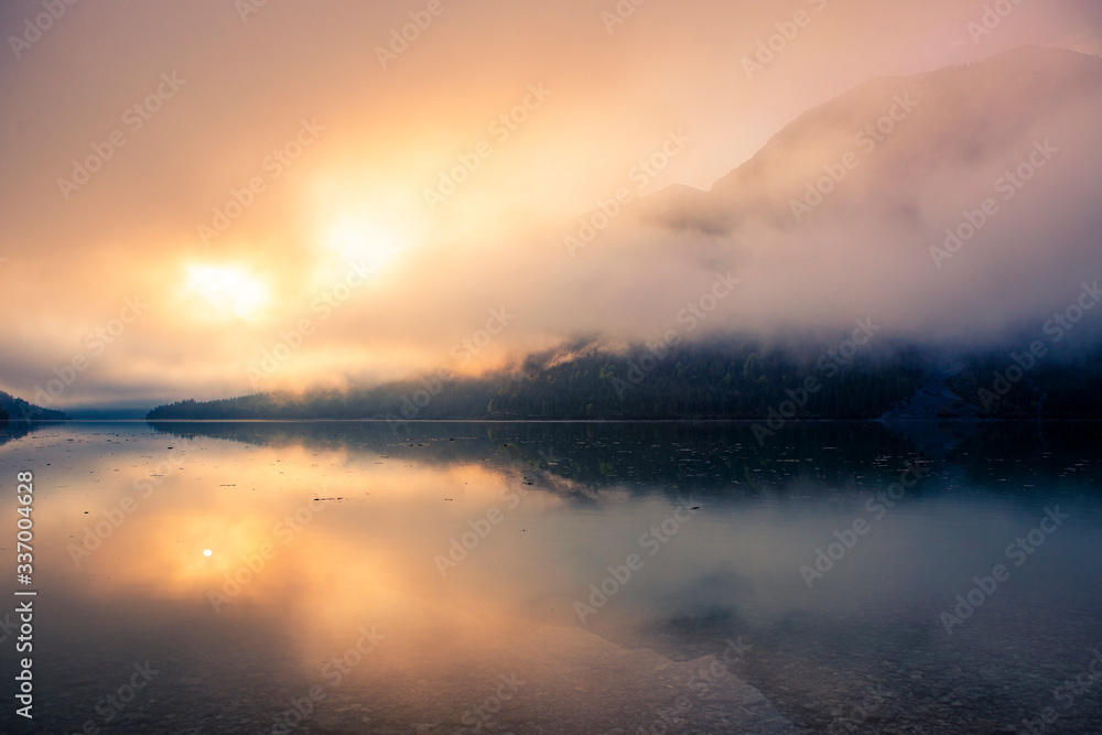 Plansee in the morning with sunrise and fog