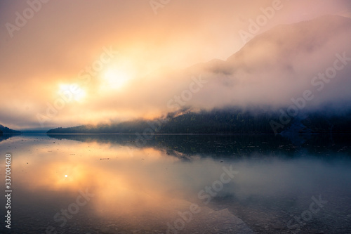Plansee in the morning with sunrise and fog