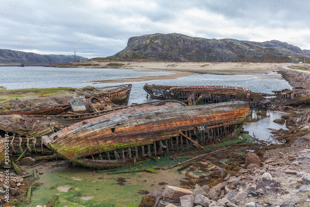 Cemetery of old ships in Teriberka Murmansk Russia, dramatic photo. Aerial top view.