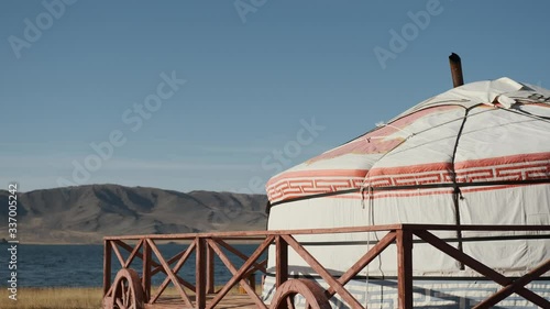 lonely Yurt in a picturesque place in Mongolia on shore of beautiful lake,remote and wild place steppe,in distant mountains altai