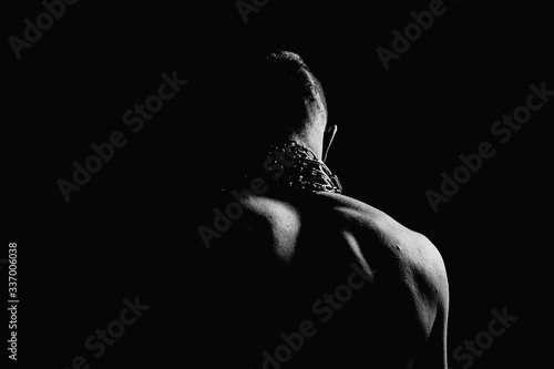 Pumped athlete's back. Back. Chain on back. Sport. Black and white background. In the hands of chains. Sport is our everything. Shoulders. © Alex