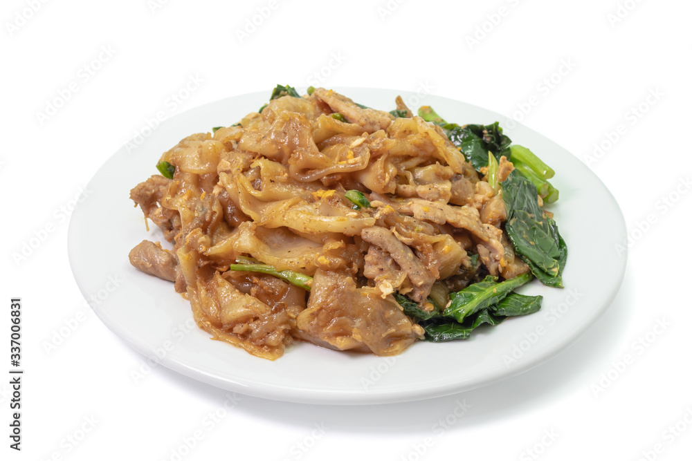 The close up of Fried Noodle with soy sauce on white plate on white background.