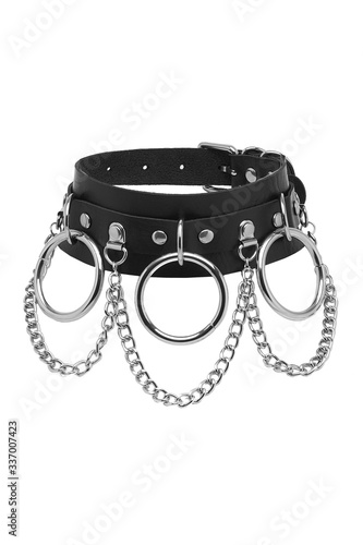 Subject shot of a black leather choker with steel rivets, chrome-plated rings, D-rings and chains. The stylish accessory is isolated on the white background. 