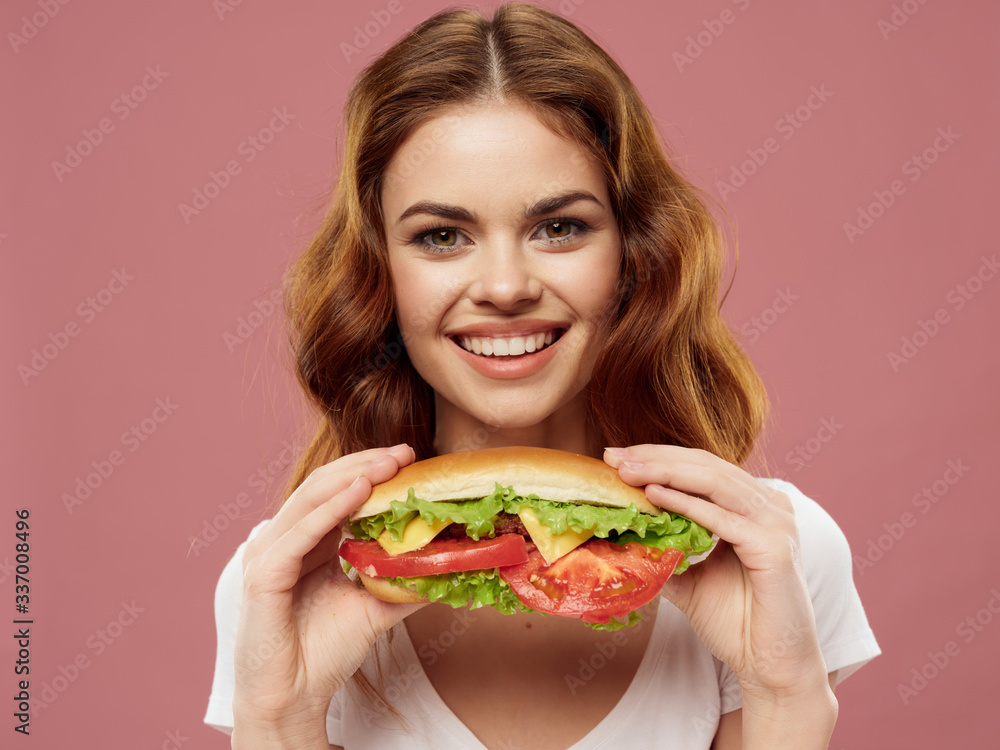 young woman eating a sandwich