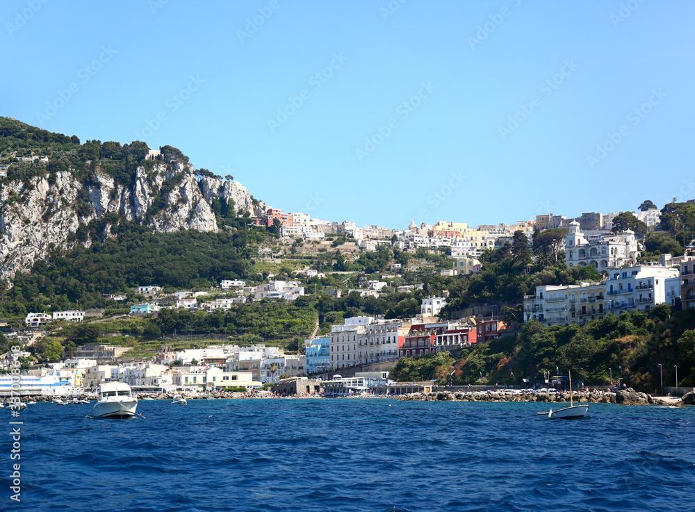 Capri, Italy: Panoramic view from the Marina Grande to the town in the hills up above.