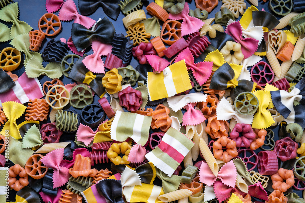 Cheerful colorful italian pasta. Different types of Italian pasta lying on top of each other