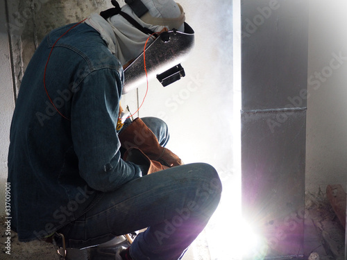 Welding work ,worker with protective welding metal on construction