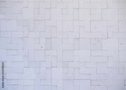 White embossed stone wall with geometric patterns for the background