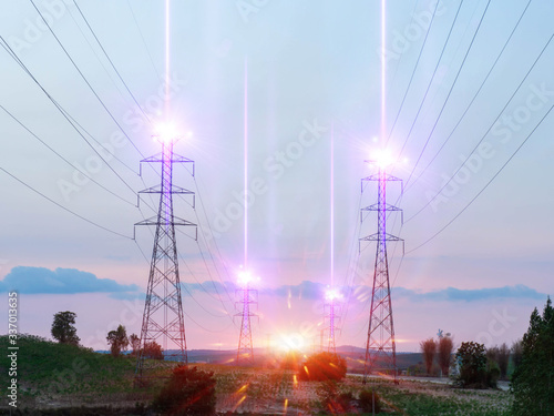 Sunset with a transmission tower, High voltage towers aganist the sunset background. photo