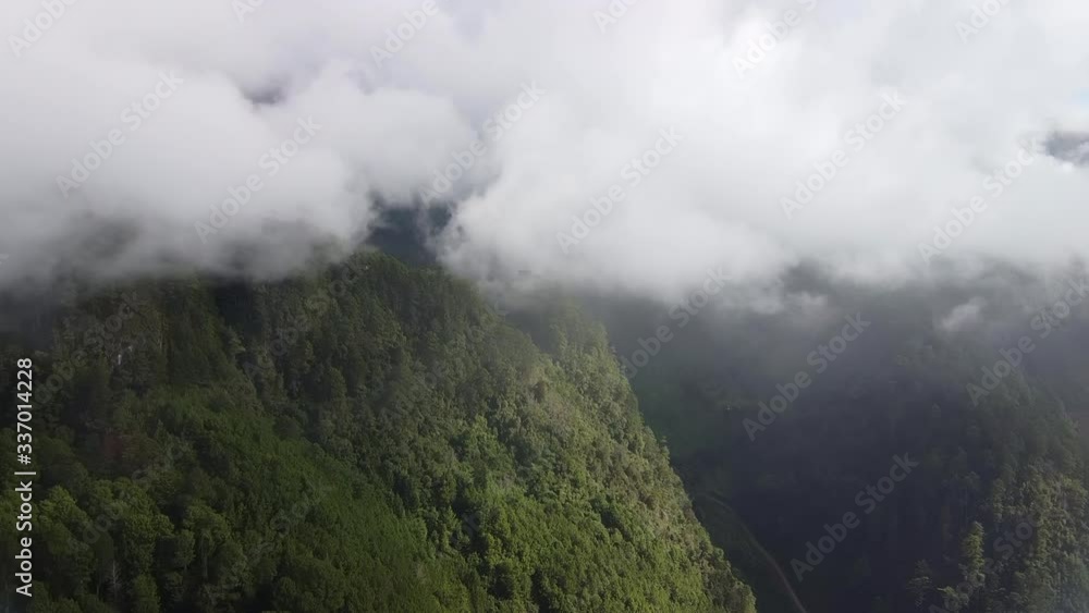 Aerial fly through thing Clouds towards a Steep Valley Aerial fly through thing Clouds towards a Steep Valley