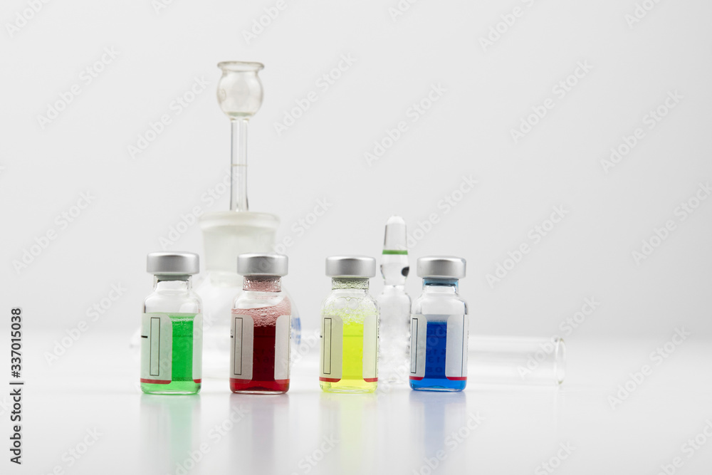 Glass vials containing coloured solutions as a medical treatment for the pharmaceutical industry Glass vials containing coloured solutions as a medical treatment for the pharmaceutical industry