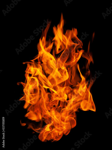 Fire and burning flame isolated on dark background for graphic design purpose © Akarawut