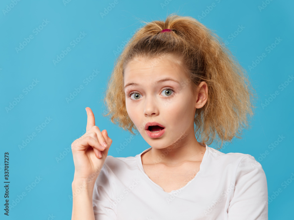 young woman with finger on lips young woman with finger on lips