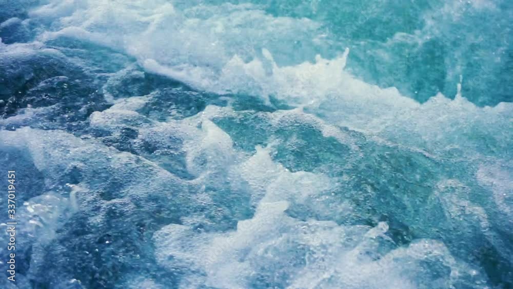 A powerful stream of water flows at high speed A powerful stream of water flows at high speed