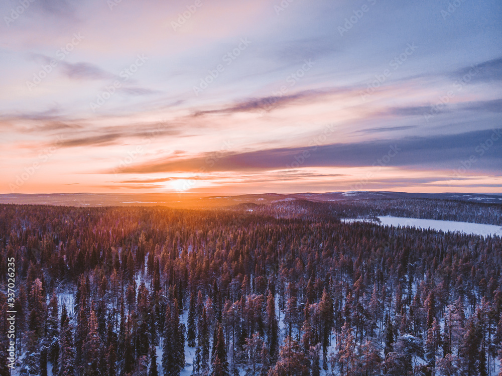 Charming winter sunset in Lapland Charming winter sunset in Lapland