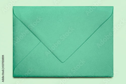 Close-up of old green envelope , texture background