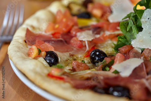 Close up image of Pizza with shallow depth of field. Selective focus