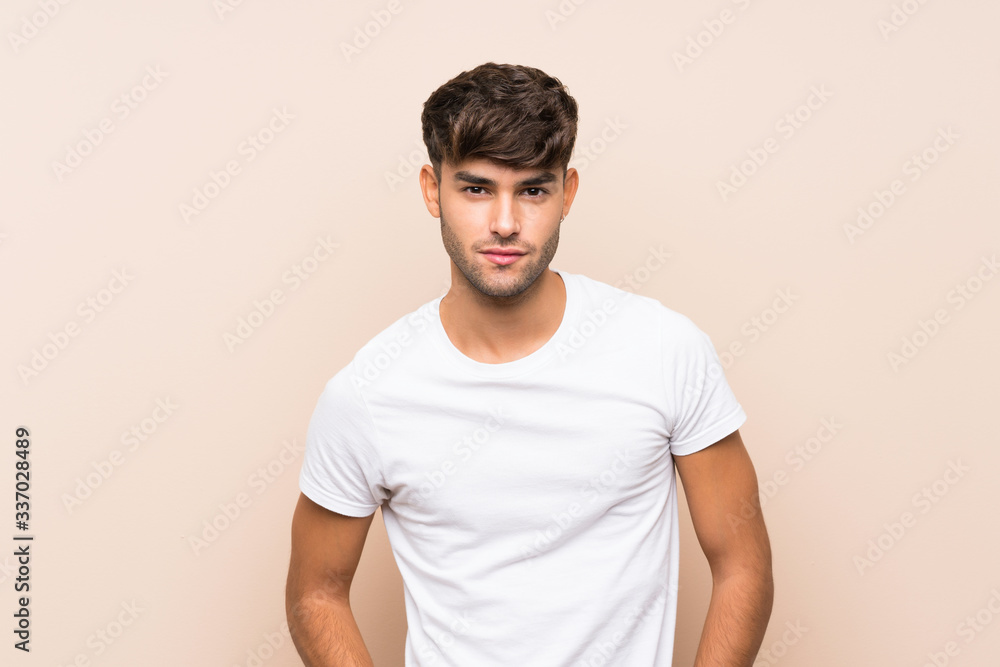 Young man over isolated background Young man over isolated background