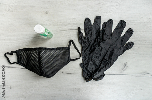 Anti virus protection mask and gloves on the wooden table
