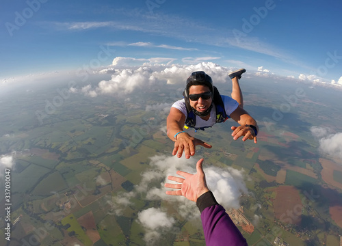 Skydiver hand shake point of view