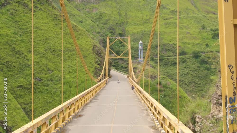 Hanging bridge in the middle of the Colombian mountains. Drone footage. Hanging bridge in the middle of the Colombian mountains. Drone footage.