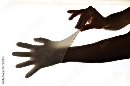Billede på lærred Removing latex gloves from hands