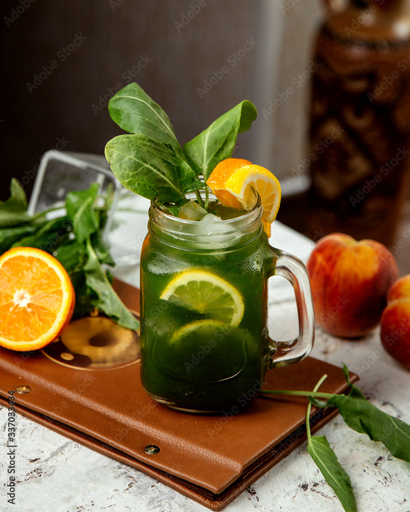 Fototapeta premium homemade ice tea with herbs and orange