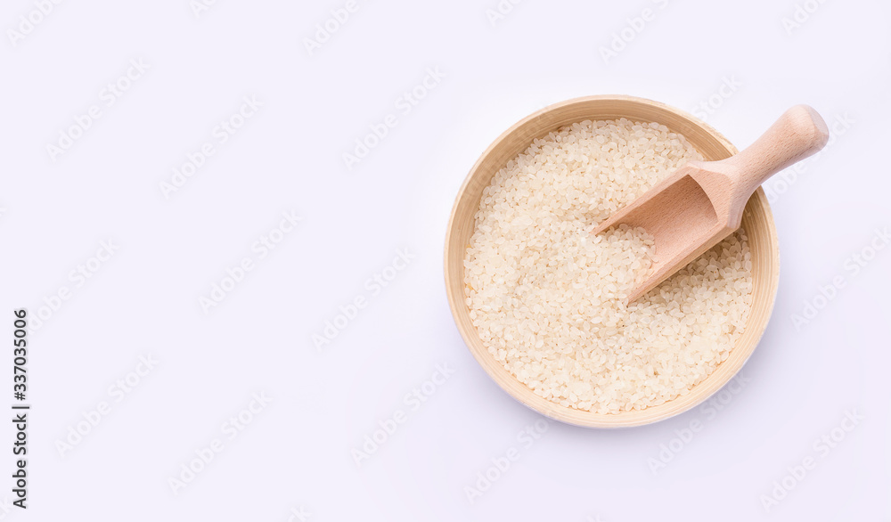 rice in a bowl of bamboo on a white background. copy space. banner rice in a bowl of bamboo on a white background. copy space. banner