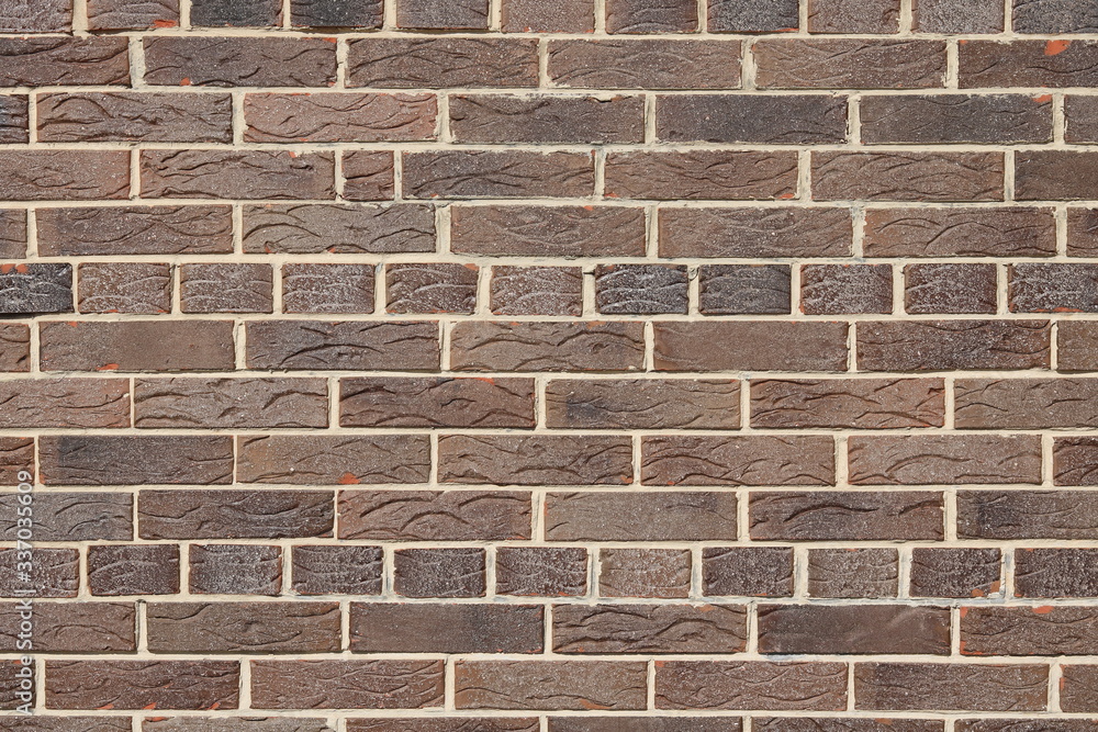Brown background of beautiful unusual building brick Brown background of beautiful unusual building brick