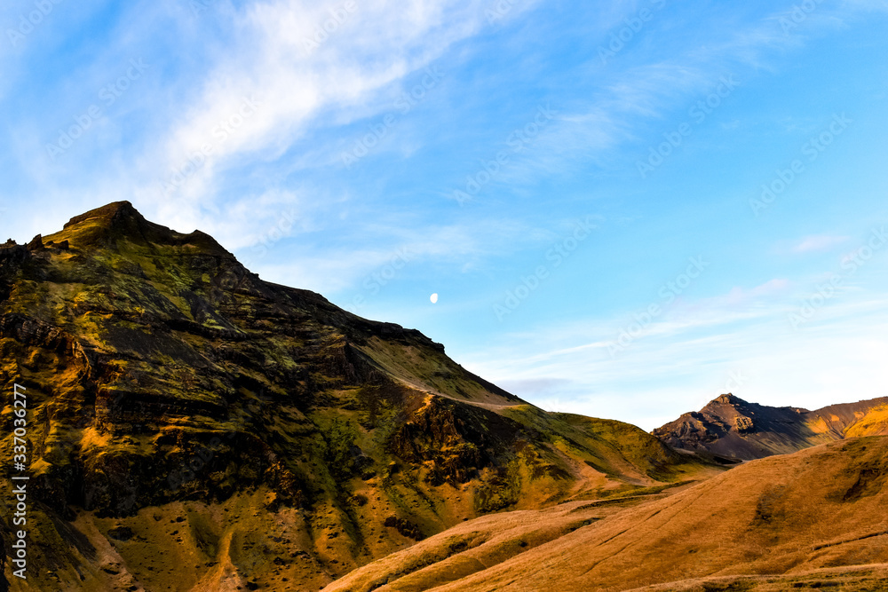 A view of the sky and mountain from Skogafoss