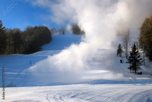 Snow making machines billow new snow onto the ski slopes in Vermont
