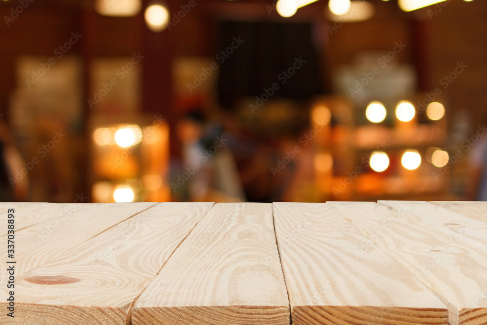 wooden table in front of abstract blurred bokeh background