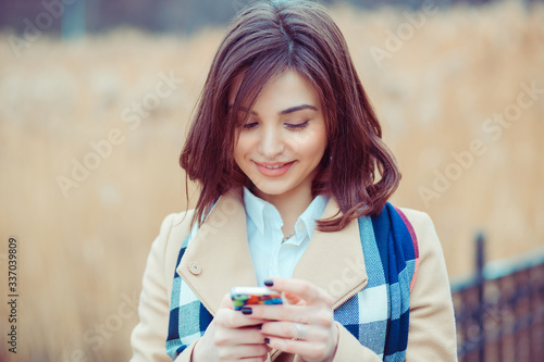 Happy woman texting