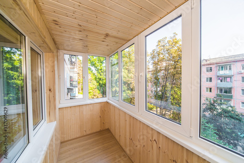 White metal-plastic windows of balcony in modern apartment