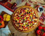 mixed pizza with meat olives pepper and mushrooms
