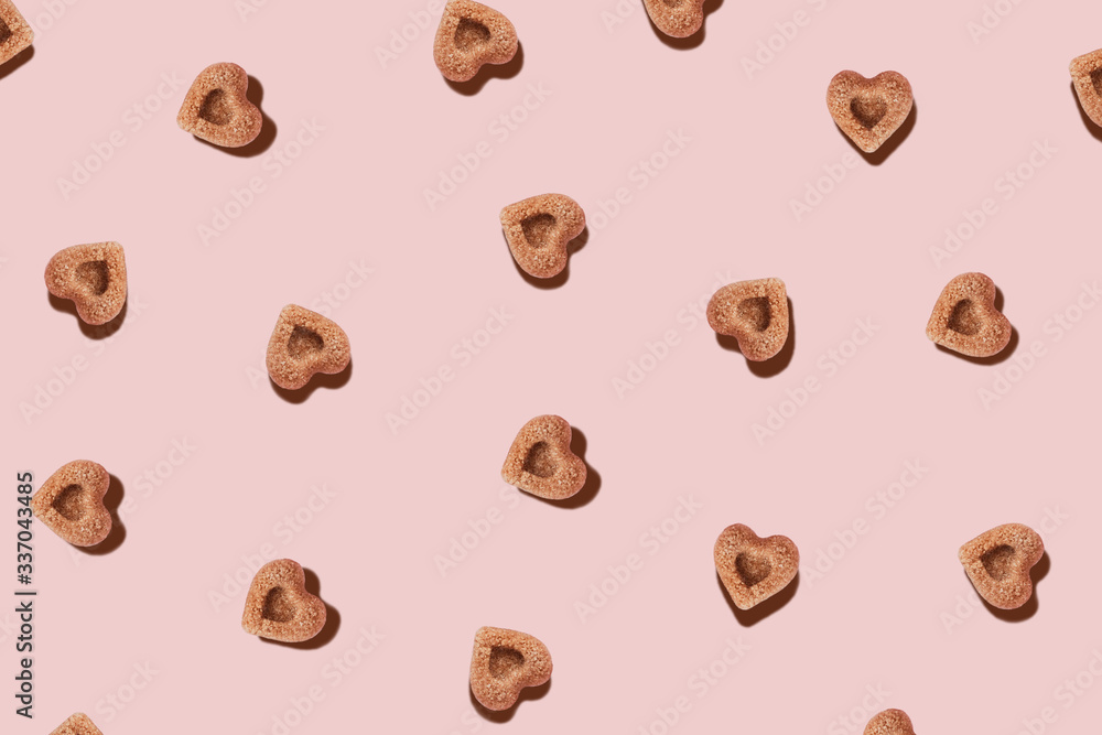 Pattern with pieces of sugar in the shape of hearts. Pattern with pieces of sugar in the shape of hearts.