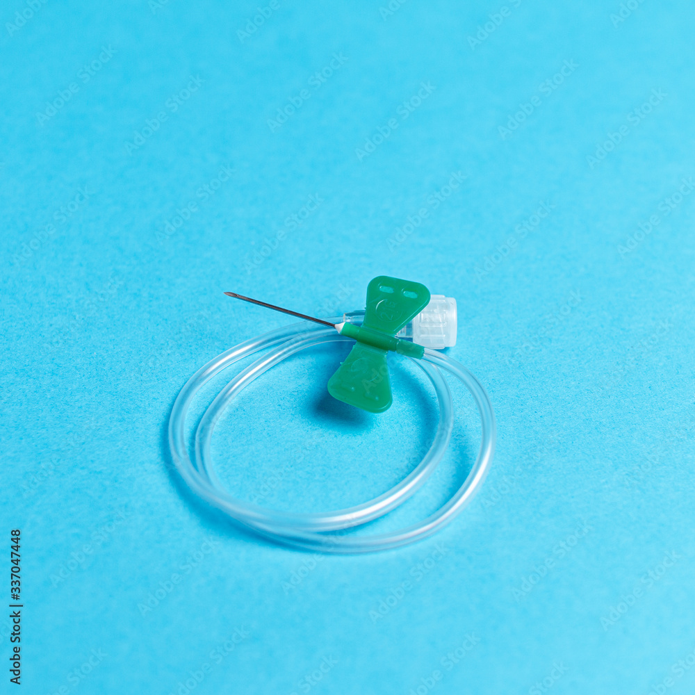 Catheter on a blue background. Medical topic Catheter on a blue background. Medical topic