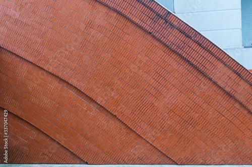 Brown brick on an arch wall. Background and pattern