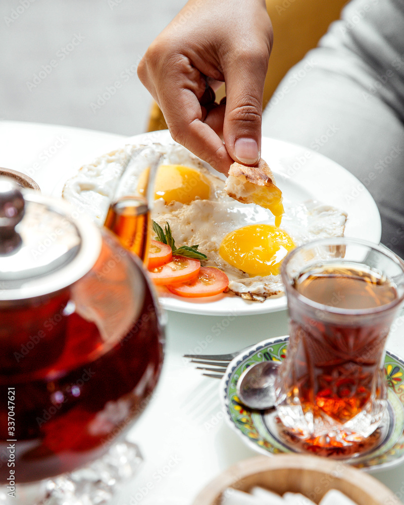 omelette and black tea on table omelette and black tea on table
